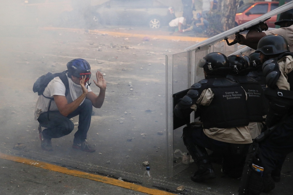 Venezuela Protestor Confronts Police